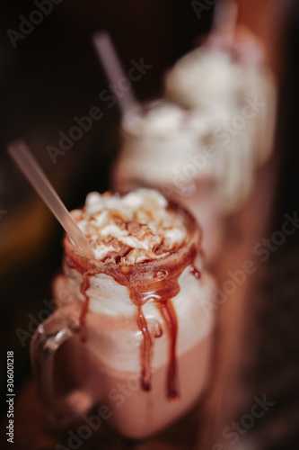 Close up shot of caramel milkshakes with marshmallows. Concept of restaurant, drinks and hospitality..