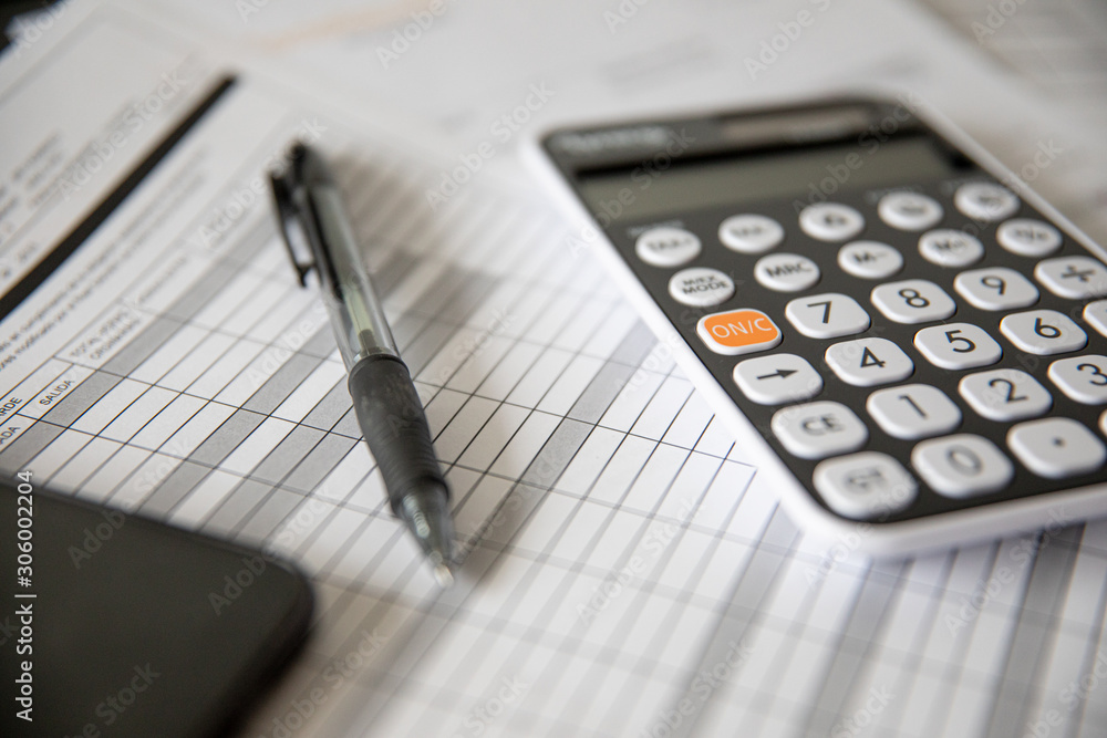 calculator and pen on background calculator and pen on background