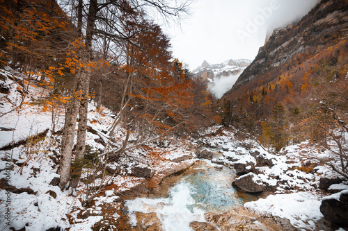 Ordesa National Valley in snowy autumn, located in Pyrenees Spain