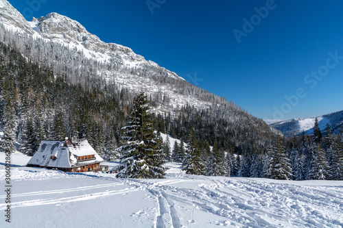 tatra mountains with wooden hut with snow during winter, Zakopane, Poland