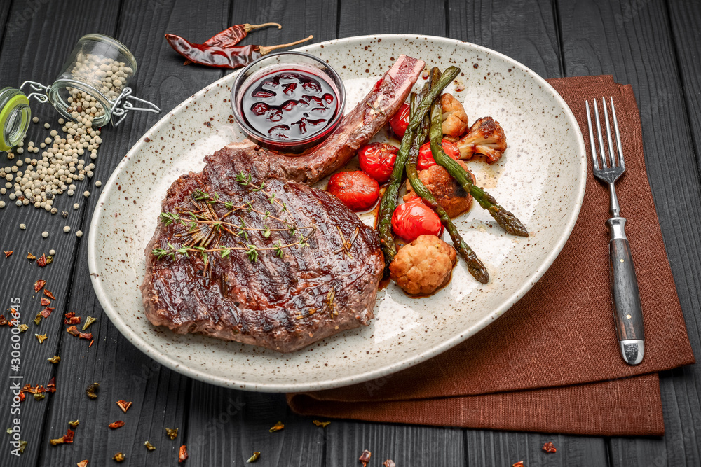 Grilled meat and vegetables on rustic wooden table Grilled meat and vegetables on rustic wooden table