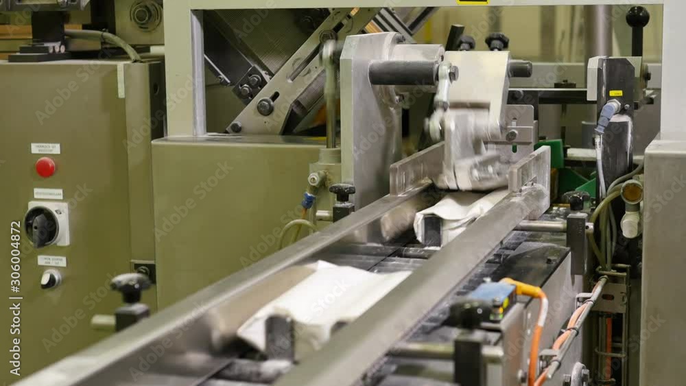 Bags with cooking flower on production line in bakery factory Bags with cooking flower on production line in bakery factory