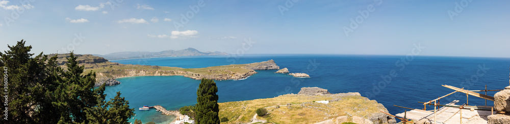 A blue sea and mountains in sunny summer day. St Paul's Bay in Rhodes Greece Europe.