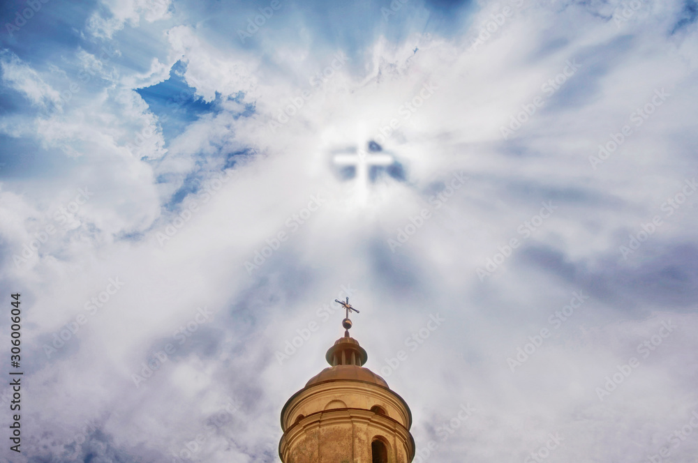 The dome of the old church. Symbolic cross on background with sun in cloudy sky.