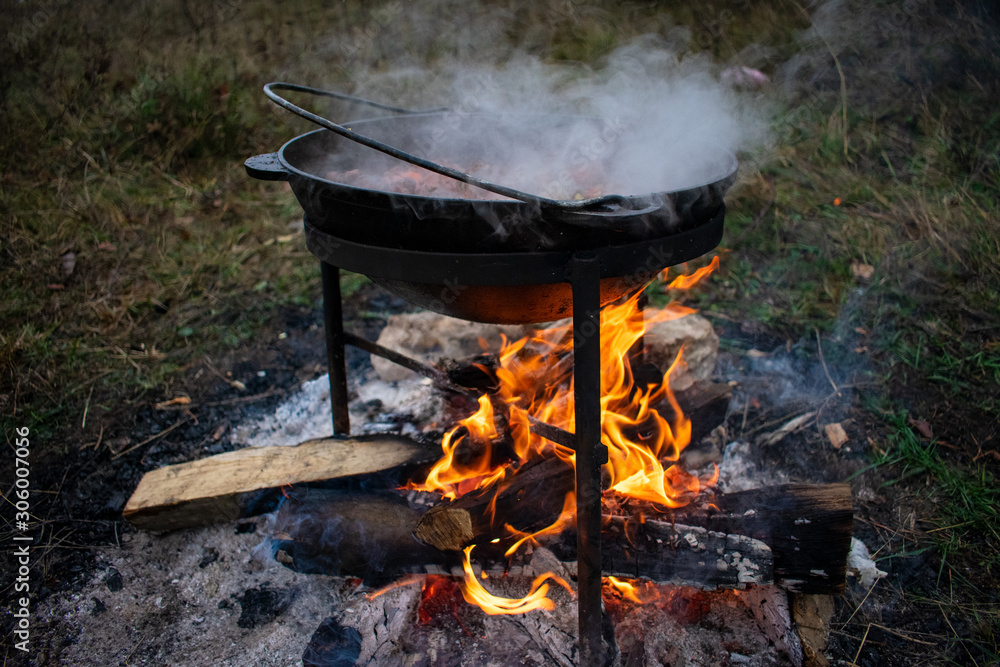 cooking in a cauldron in nature cooking in a cauldron in nature
