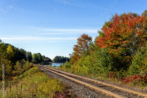Railway tracks in a rural scene in nice autumn sunny day
