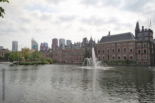 Pool with a fountain named hofvijver in front of the parliament building Binnenhof in The Hague, the Netherlands