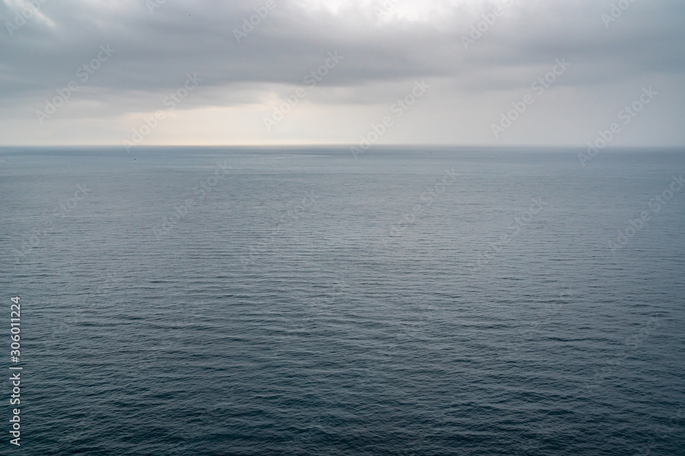 Blue sea surface with small waves in cloudy day. Blue sea surface with small waves in cloudy day.