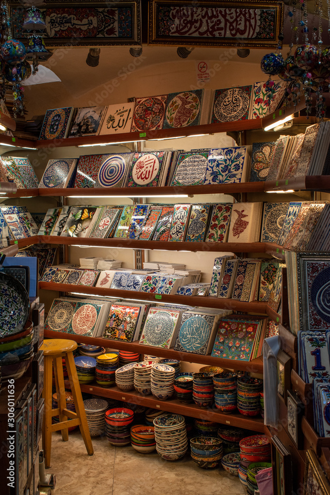 Fototapeta premium Istanbul, Turkey: ceramic shop inside the Grand Bazaar, one of the largest and oldest covered markets in the world with 61 covered streets and over 4,000 shops, one of city top attraction