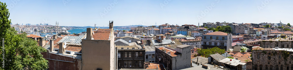 Istanbul, Turkey, Middle East: a breathtaking and panoramic view of the skyline of the city with its roofs, mosques, minarets and the Bosphorus, the Strait of Istanbul, seen from the Bazaar District 