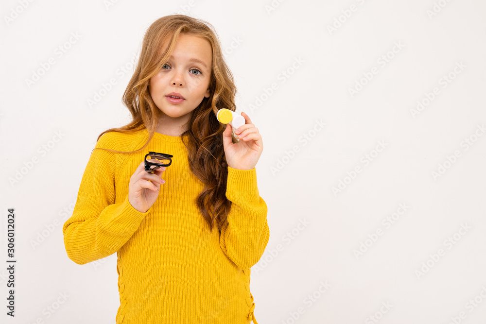 girl shows that she does not need lenses and glasses in the studio on a white background girl shows that she does not need lenses and glasses in the studio on a white background