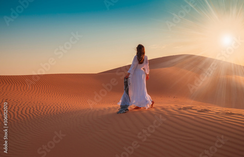 UAE. Woman in desert