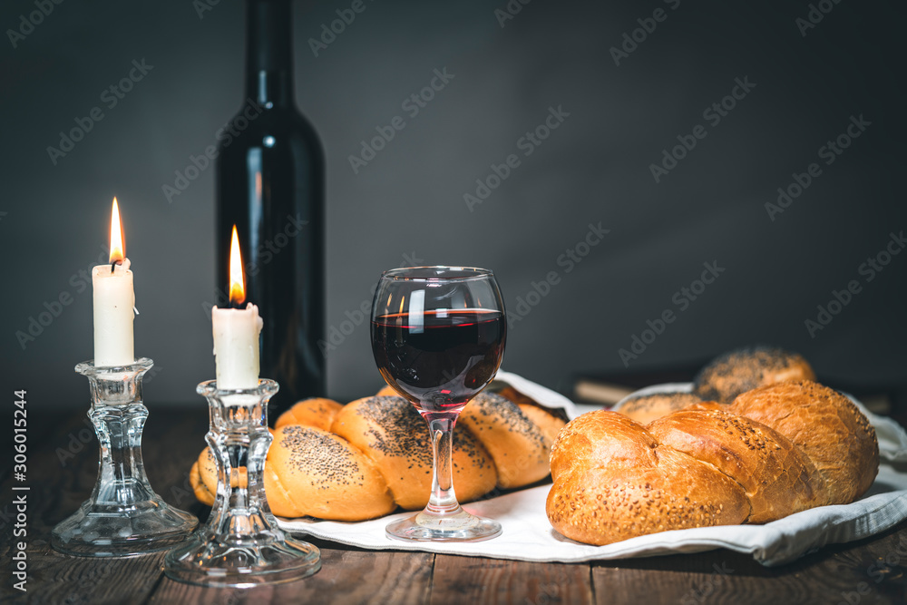 Shabbat Shalom. Challah bread, shabbat wine and candles on wooden table. Shabbat Shalom. Challah bread, shabbat wine and candles on wooden table.