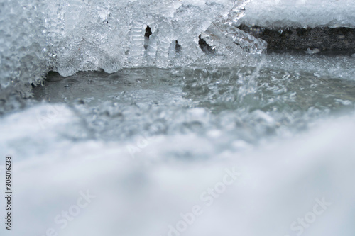 Ice and icicles melting in winter. © Natasa
