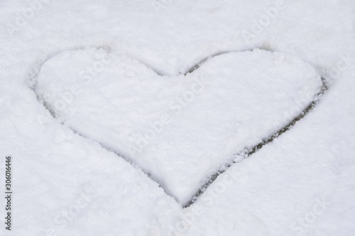 Heart drawn in the white snow. © Natasa