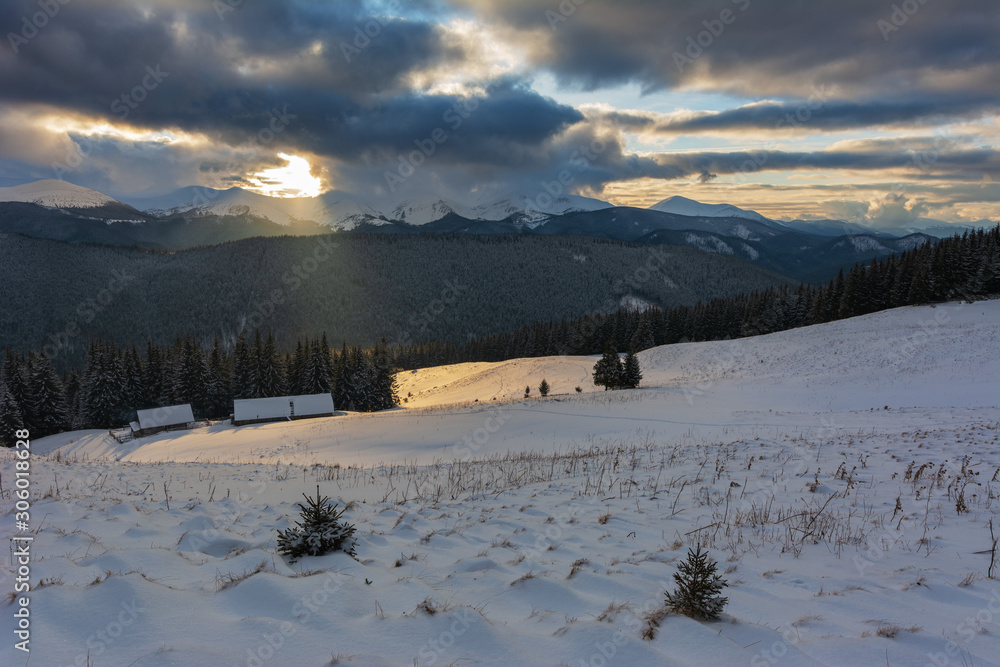 Fototapeta premium Colorful winter dawn on the mountain valleys in the Ukrainian Carpathian Mountains. 