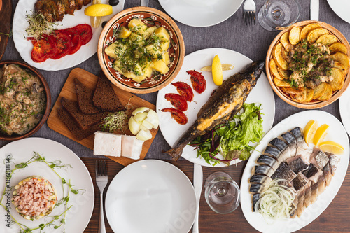 A generous and hospitable table with Ukrainian national traditional vegetable and meat dishes served to the New Year holidays, Christmas, Easter and treats for friends birthday. Top view