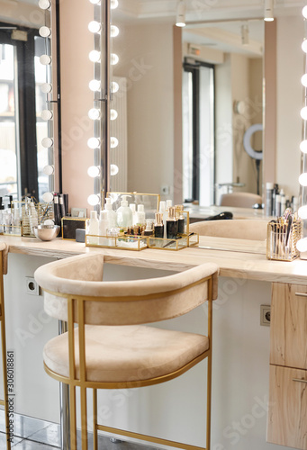 Dressing room interior with makeup mirror and table. Place for applying makeup