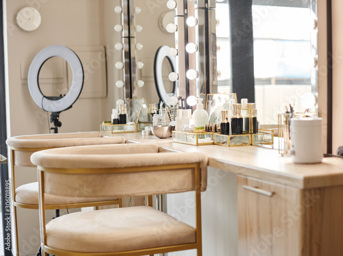 Dressing room interior with makeup mirror and table. Place for applying makeup