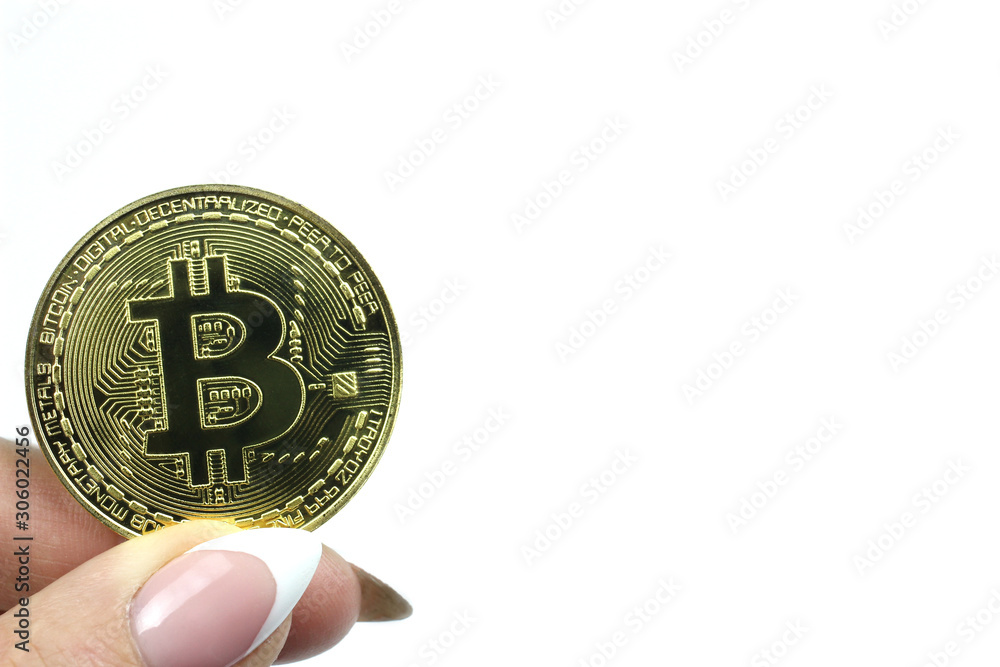 Bitcoin in woman hand isolated on white background. Virtual money, crypto currency Bitcoin in woman hand isolated on white background. Virtual money, crypto currency
