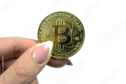 Bitcoin in woman hand isolated on white background. Virtual money, crypto currency