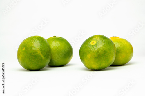 four tangerines on the table