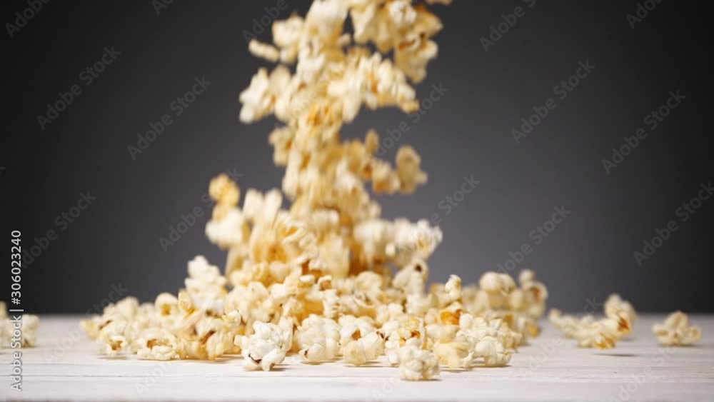 Popcorn is falling down on the table. Slow motion. No people Popcorn is falling down on the table. Slow motion. No people
