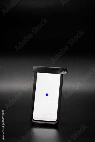 Smartphone with tape covering the phones camera