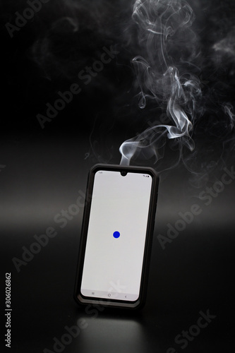 smoke coming from a smartphone with a white screen