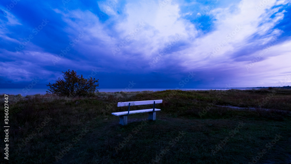 bench at sea in stormy weather