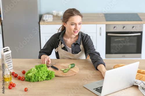 Woman preparing tasty veget...