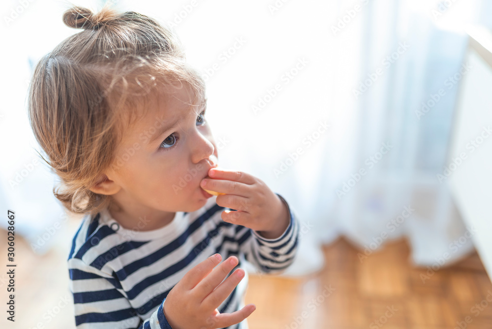 Baby boy eating healthy food. Baby with banana. Happy kid enjoy eating fresh fruit. Healthy food for children concept. Children eat bananas for health. Healty children's snack Baby boy eating healthy food. Baby with banana. Happy kid enjoy eating fresh fruit. Healthy food for children concept. Children eat bananas for health. Healty children's snack