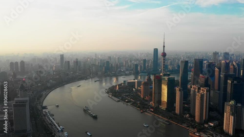 Shanghai Lujiazui business district Aerial with drone scene dolly in movement to central of city in sunrise