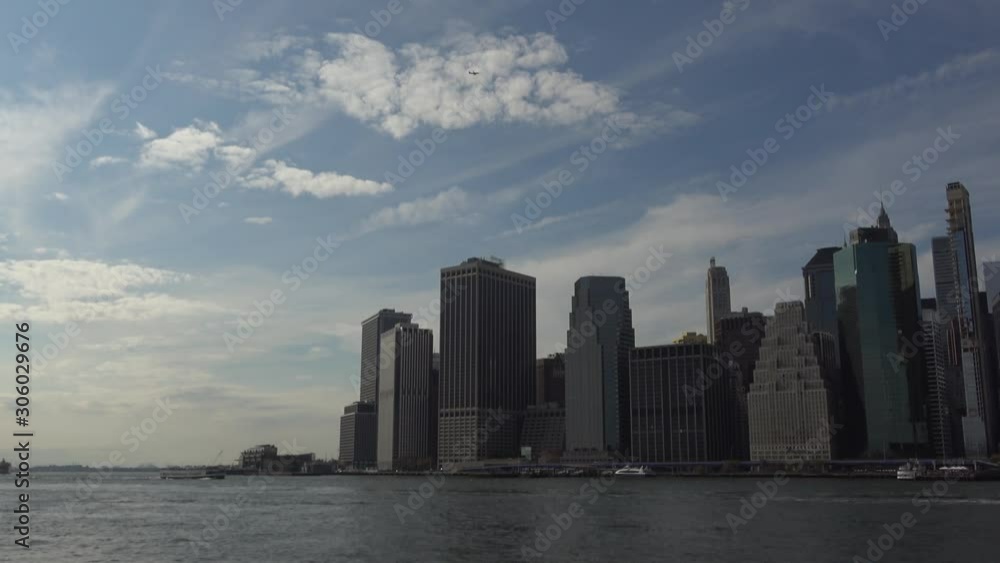4K. Ultra HD. Tall buildings of New York seen from the river. Skyline close-up to the Manhattan skyline, New York. Of the most tourist cities. United States of America. Travel concepts. 4K. Ultra HD. Tall buildings of New York seen from the river. Skyline close-up to the Manhattan skyline, New York. Of the most tourist cities. United States of America. Travel concepts.