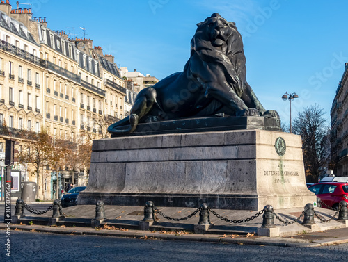 Lion of Belfort statue in Denfert Rochereau square - Paris, France. The Lion of Belfort is a bronze sculpture by Frederic Auguste Bartholdi (1834-1904). photo