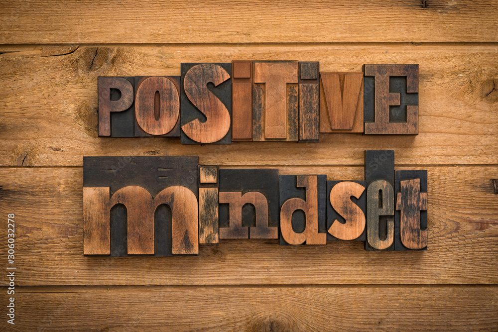 positive mindset, phrase written with vintage letterpress printing blocks on rustic wood background - obrazy, fototapety, plakaty 