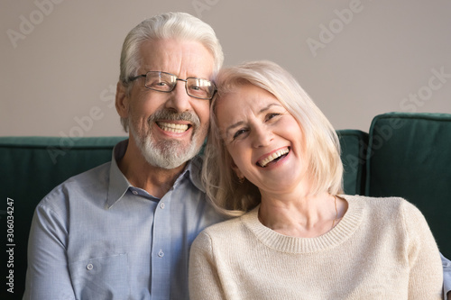 Head shot portrait of laughing elderly attractive couple © fizkes