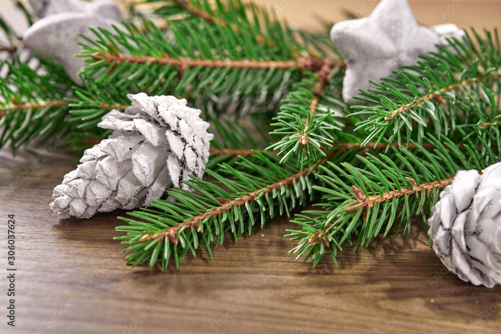 Christmas card - Christmas tree branches on the wooden background Christmas card - Christmas tree branches on the wooden background