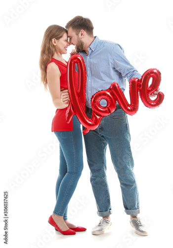 Happy young couple with bal...