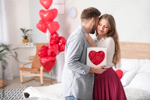 Happy young couple celebrat...