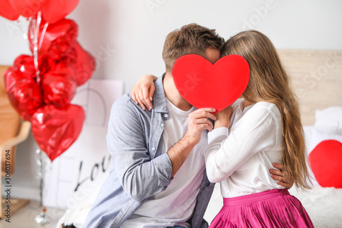 Happy young couple celebrat...