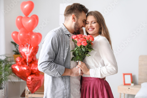 Happy young couple celebrat...