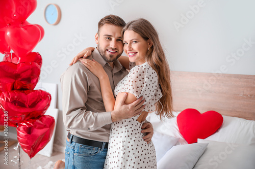 Happy young couple celebrat...