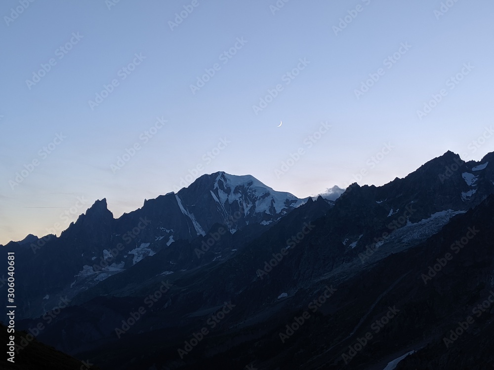 Silhouette of mountains in the Alps with snow on peaks