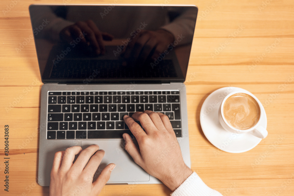 Man working with laptop, top view . Man working with laptop, top view .