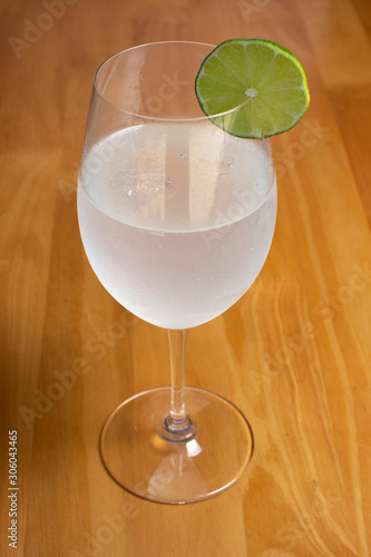  gic tonic liquor drink accompanied by lemon photo