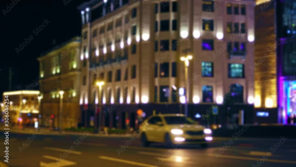 Time Lapse. Defocused view of a busy city street. Night. Heavy traffic. Bright, colorful, illuminated building facades. Parked cars. People walk, many pedestrians on the sidewalk. Ultra HD Timelapse Time Lapse. Defocused view of a busy city street. Night. Heavy traffic. Bright, colorful, illuminated building facades. Parked cars. People walk, many pedestrians on the sidewalk. Ultra HD Timelapse