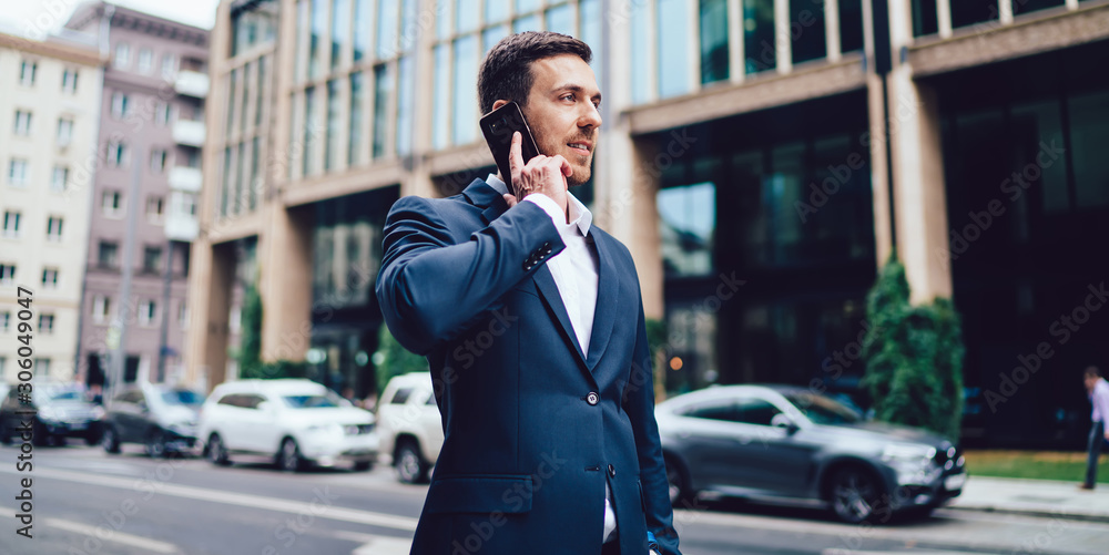 Caucasian man in formal wear making smartphone international conversation discussing business project, intelligent male corporate director using roaming 4g for phoning via modern mobile gadget