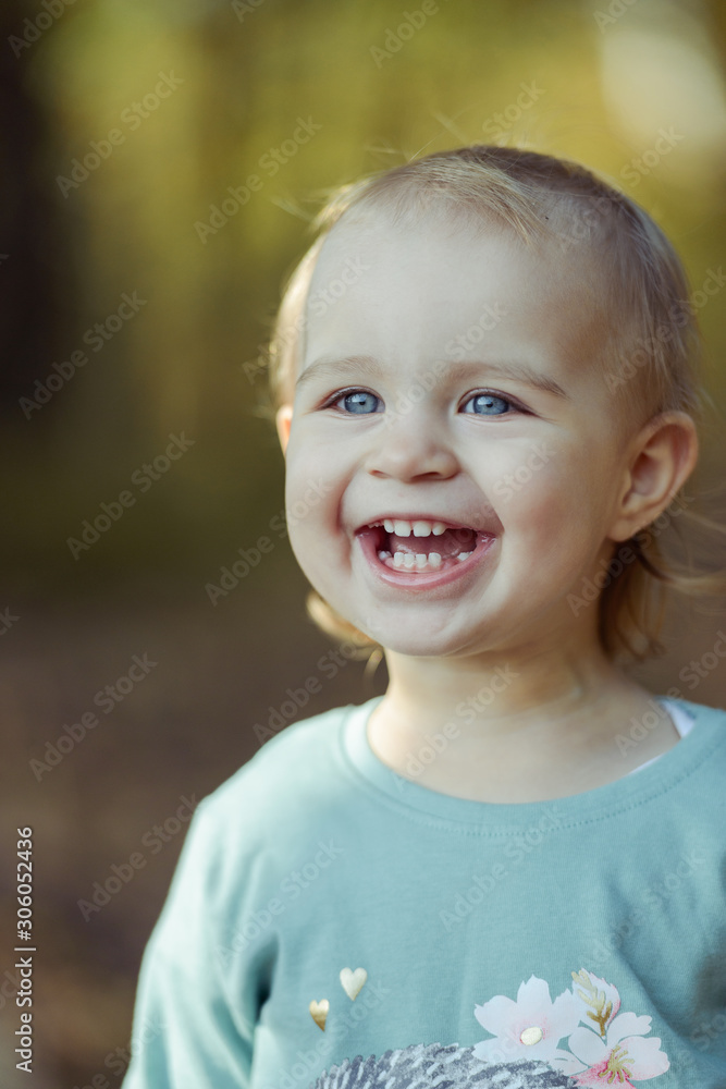 Adorable girl having fun on beautiful autumn day. authentic childhood image. Adorable girl having fun on beautiful autumn day. authentic childhood image.