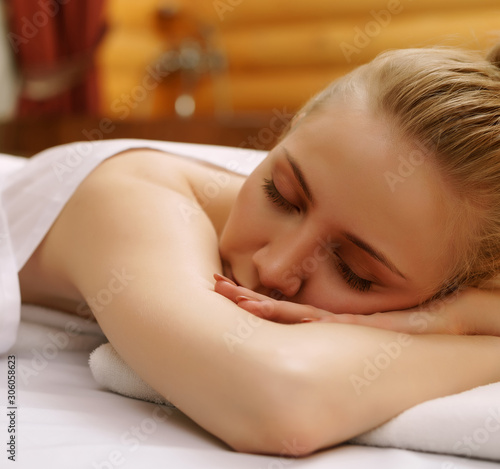 Spa. Portrait of relaxed woman during massage